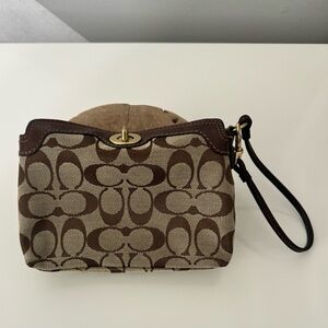 Coach brown fabric wristlet like new condition.